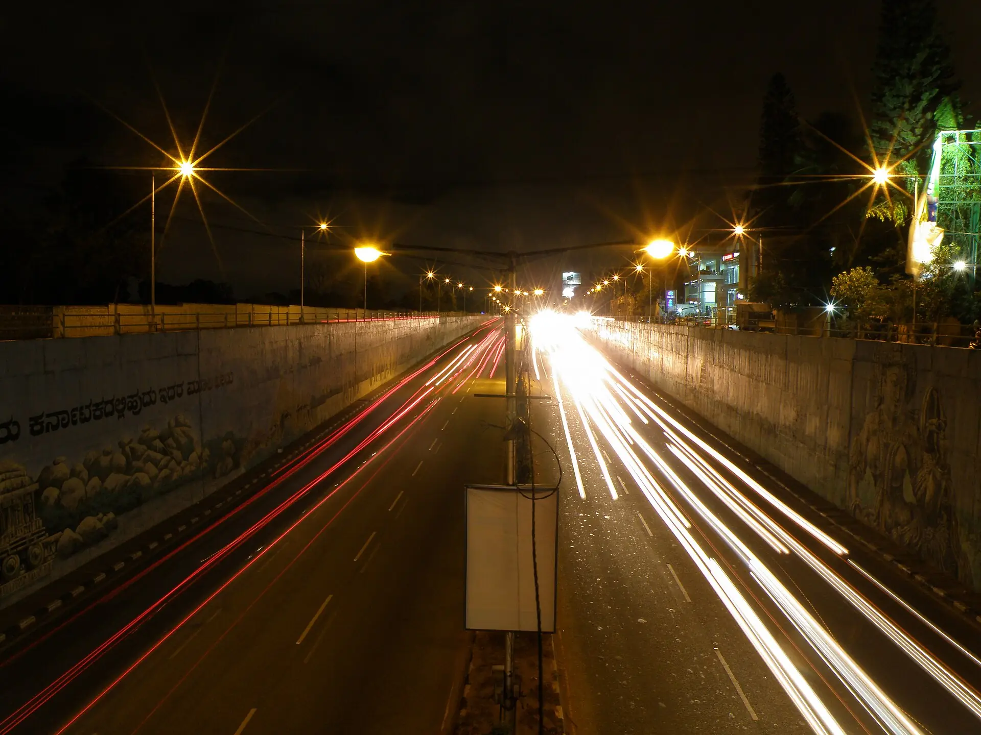 Light trails from evening traffic through the Mekhri Circle underpass in Bengaluru
